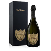 A bottle of Dom Perignon Champagne with its packaging box. The bottle is sealed and has a label with the Dom Perignon branding and the year 2015 visible.
