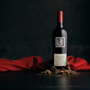 Bottle of Two Hands Secret Block Single Vineyard Shiraz wine with a red cap and a label that includes the brand name and the vineyard's location in the Barossa Valley.