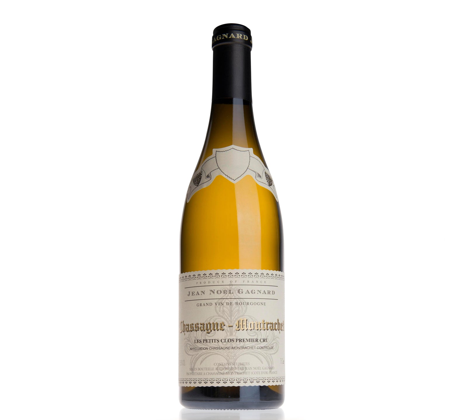Bottle of Domaine Jean Noel Gagnard Chassagne-Montrachet Les Petit Clos Premier Cru white wine with a beige label, predominantly displayed against a plain background.