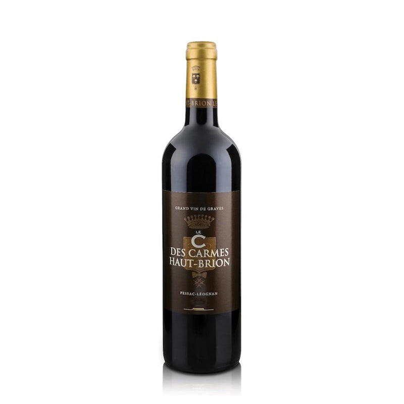 Wine bottle with 'Le C Des Carmes Haut-Brion' label on a white background