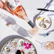 A bottle of Caves d'Esclans Rock Angel Rosé wine.