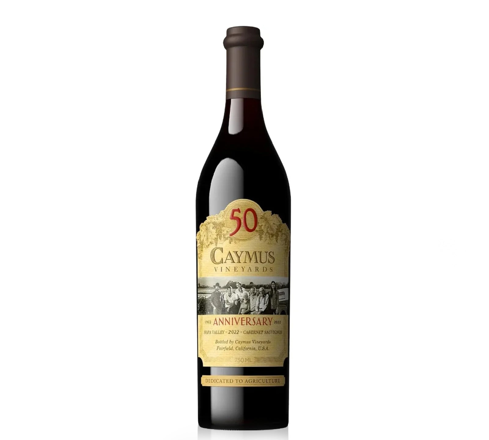 A bottle of Caymus Cabernet Sauvignon Napa Valley 50th Anniversary 2022 with a gold and black label, celebrating the winery's 50 years.