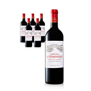 Château La Dominique red wine bottles on a white background