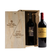 Two bottles of Chateau Léoville Poyferré wine in a wooden box.