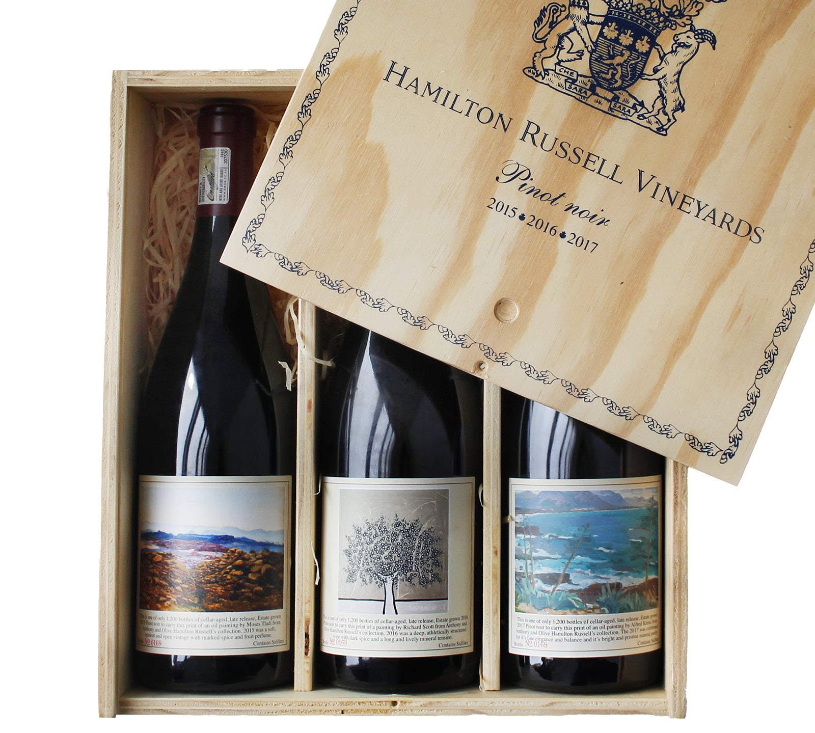 A case of three bottles of Hamilton Russell Vineyards Pinot Noir wine, with each bottle in its own compartment, displayed with the wooden lid open.