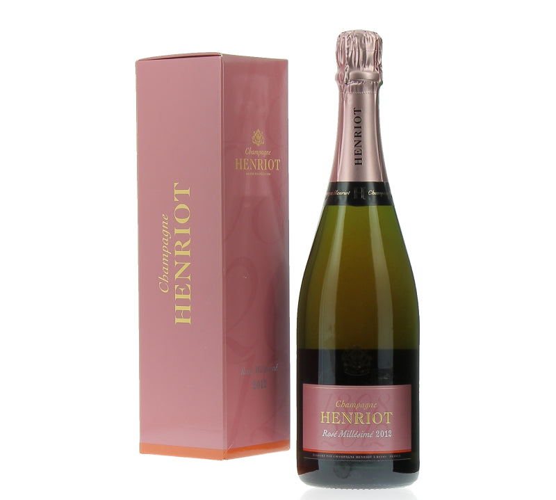 A bottle of Henriot Champagne Rose Brut Millesime 2012 with its pink packaging box.