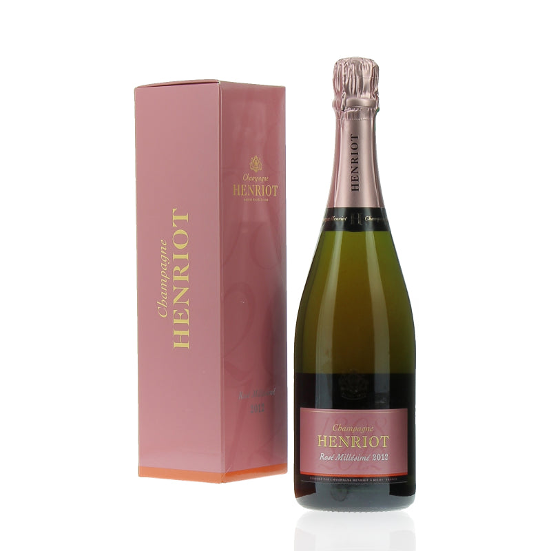 A bottle of Henriot Champagne Rose Brut Millesime 2012 with its pink packaging box.