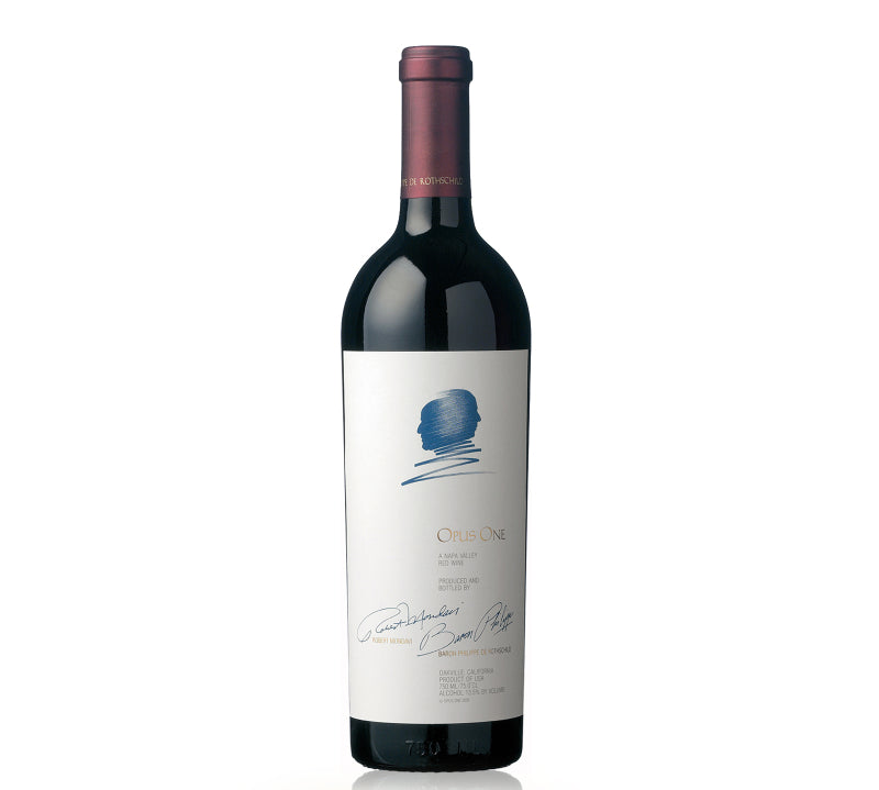 A bottle of Opus One Napa Valley Cabernet Sauvignon wine with a white label and a blue ink design.