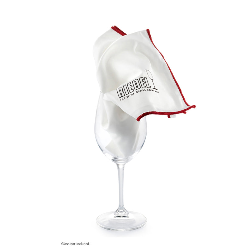 A microfiber glass polishing cloth with a white body and red trim, displayed as if in motion, possibly indicating its use in polishing a glass surface.