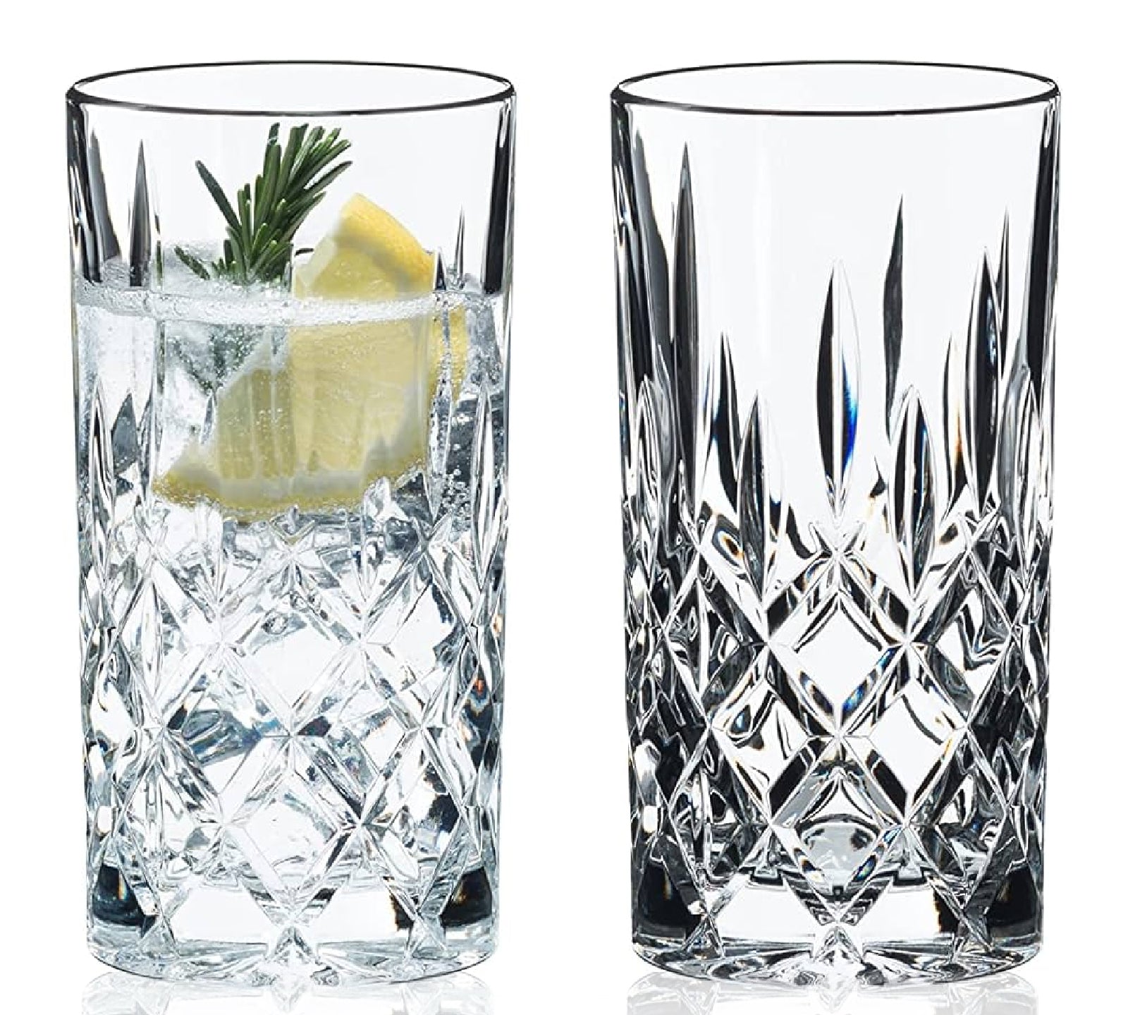 A set of two clear glass lowball tumblers with a lemon slice and a sprig of dill on one of the glasses.