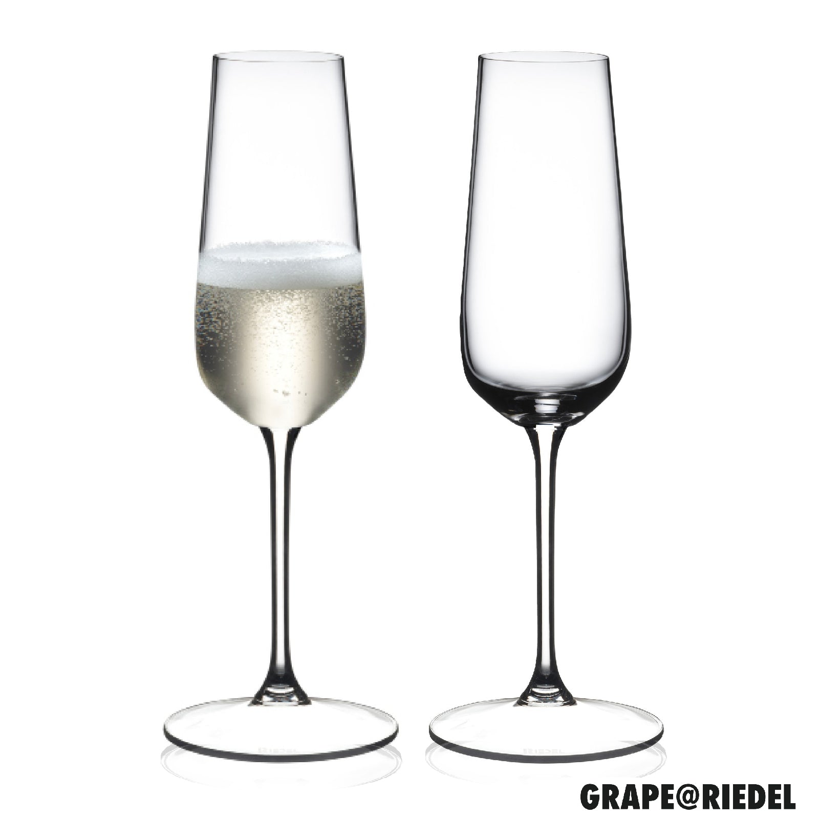 Two champagne flutes with one containing a small amount of champagne on a white background, featuring the Riedel brand.