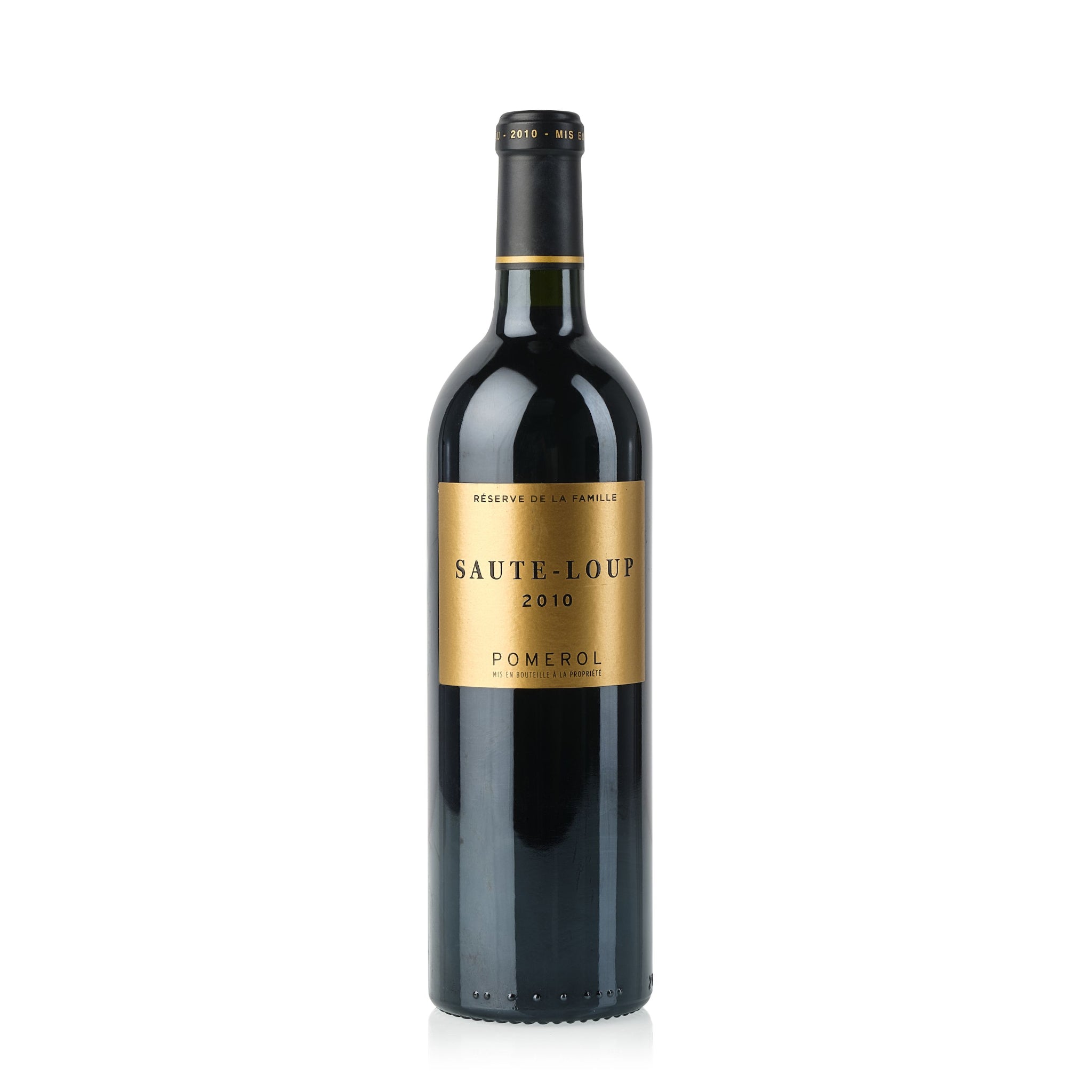A bottle of Reserves de la Vigne Saut-Loup 2010 Pomerol red wine.