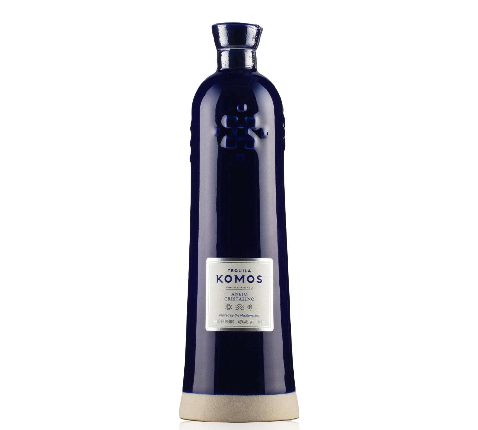 Bottle of Tequila Komos Añejo Cristalino 700ml, featuring a crystal-clear appearance and a deep blue ceramic bottle, symbolizing luxury and craftsmanship.