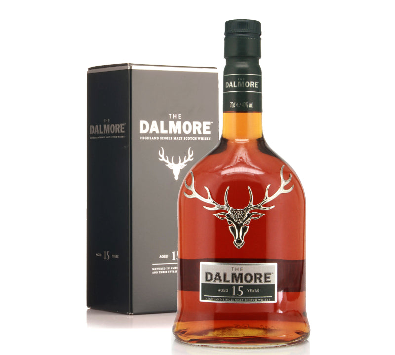 A bottle of Dalmore Single Malt Highland Whisky 15Yrs with its packaging box. The bottle has a dark cap, a label with the Dalmore logo, and a clear amber liquid visible inside.