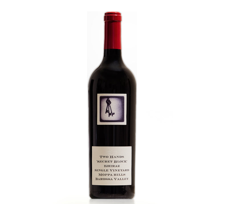 Bottle of Two Hands Secret Block Single Vineyard Shiraz wine with a red cap and a label that includes the brand name and the vineyard's location in the Barossa Valley.