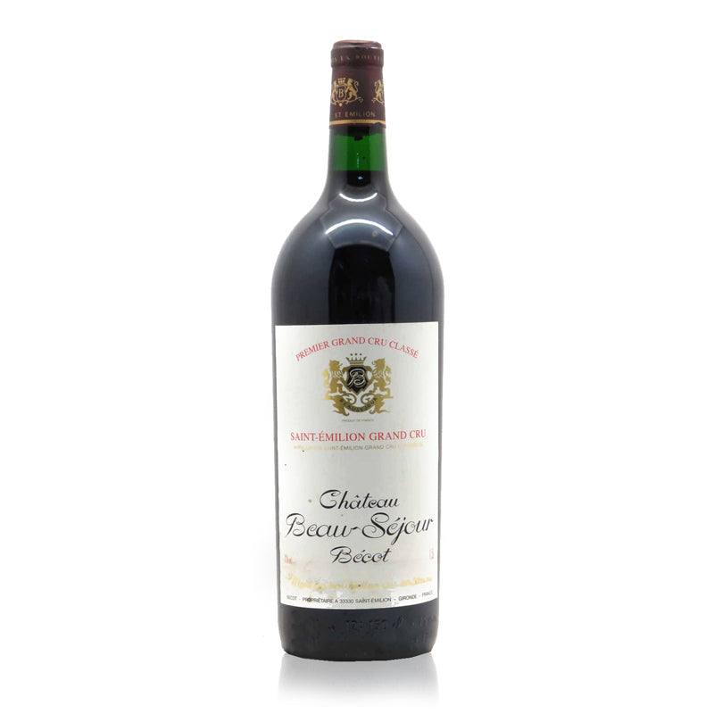 A bottle of Chateau Beau Sejour Becot St-Emilion 1975 with a level of 1500ml. The label displays the chateau's name and the vintage year.
