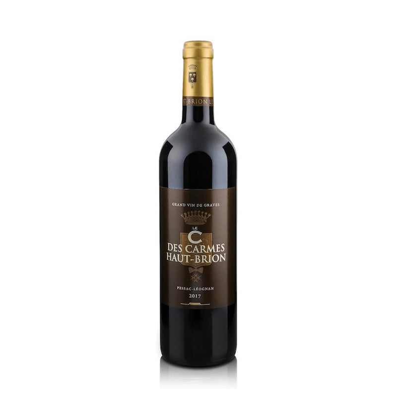 A bottle of Le C des Carmes Haut Brion Pessac-Leognan 2017 red wine with a label that includes the name of the wine and the percentage composition of the blend.