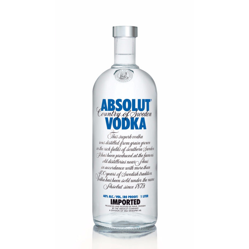 A clear glass bottle of Absolut Vodka with a blue label.
