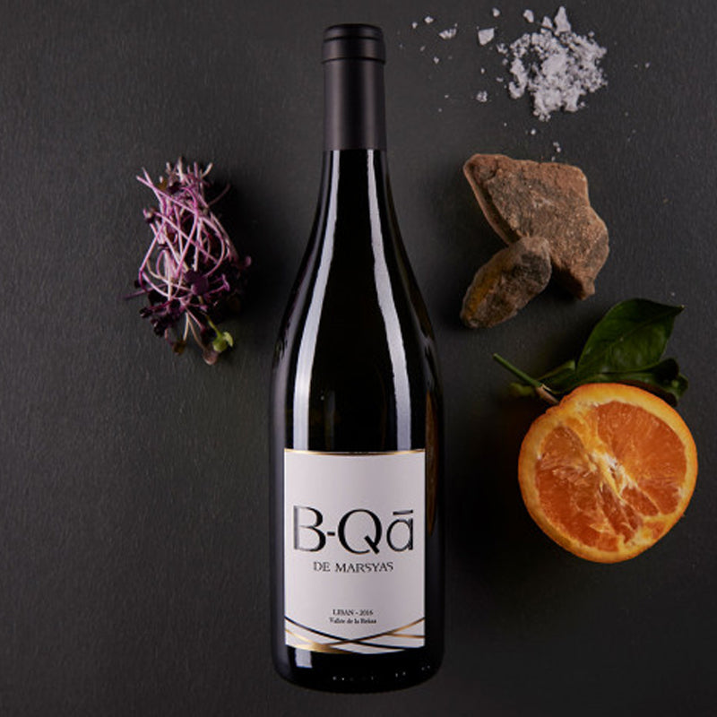A bottle of Chateau Marsyas B-Qā de Marsyas Blanc, a 750ml white wine blend from Lebanon's Bekaa Valley, with a pale yellow color.