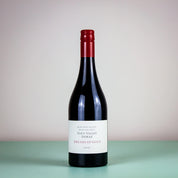 A bottle of Eden Valley Shiraz wine with a label that reads 'Dreams of Gold'. 