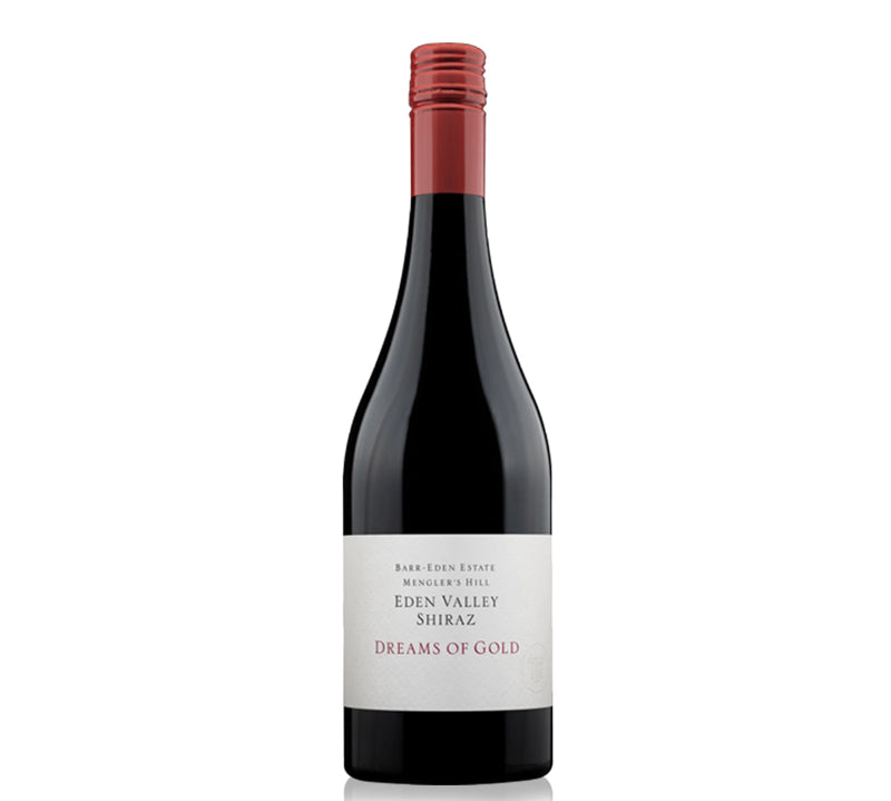 A bottle of Eden Valley Shiraz wine with a label that reads 'Dreams of Gold'. 