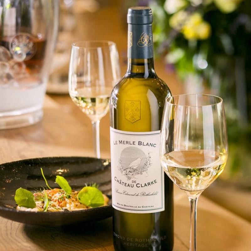 A bottle of Chateau Clarke Le Merle Blanc white wine
