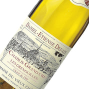 A bottle of Domaine Daniel-Etienne Defaix Chablis Grenouilles Grand Cru white wine