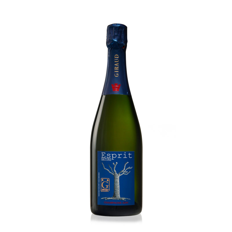 A bottle of Henri Giraud Champagne Esprit Nature with a label featuring a tree, indicating it is a product of the Champagne region.