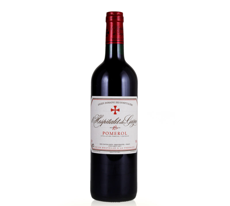 A bottle of L'Hospitalet de Gazin Pomerol red wine with a label that includes the wine name and the word 'Pomerol'.