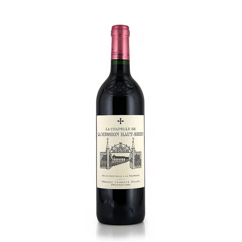 A bottle of La Chapelle de La Mission Haut Brion Pessac-Leognan red wine with a label depicting an illustration of a building.