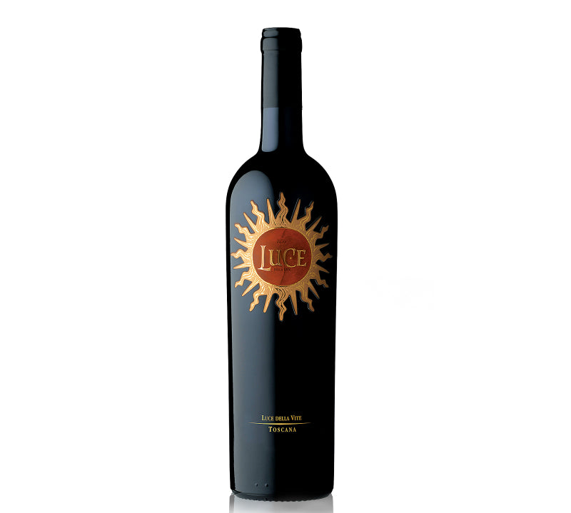 A bottle of Luce Della Vite wine with a label featuring a sun motif.
