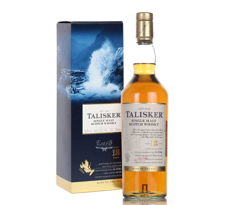 A bottle of Talisker Single Malt Scotch Whisky 18Yrs with its packaging box, displaying the whisky's color and brand details.