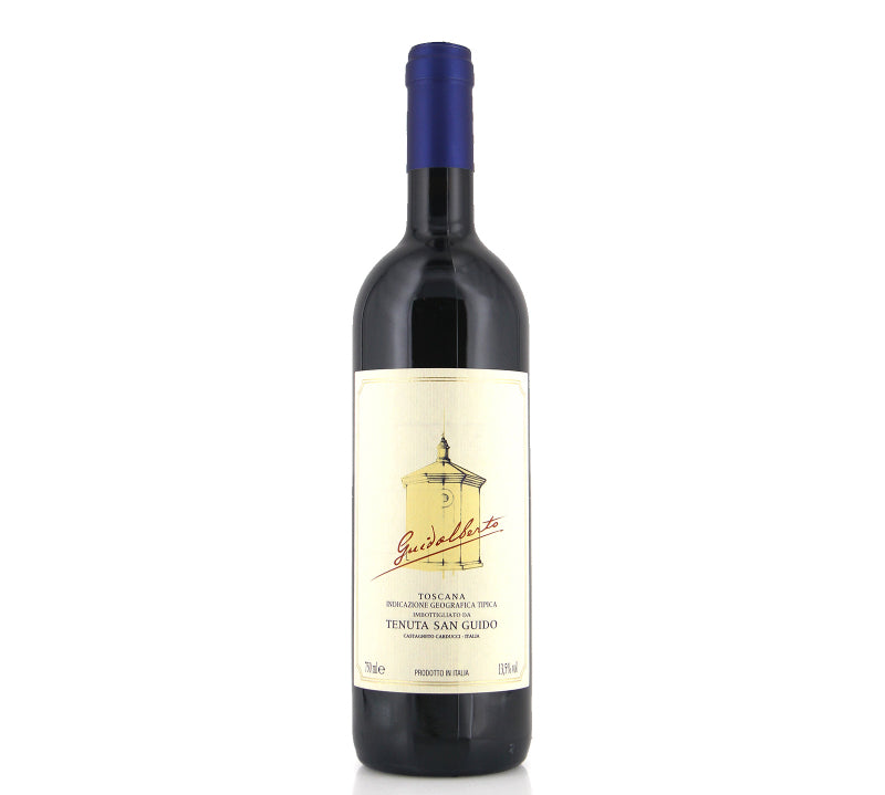 A bottle of Tenuta San Guido Guidalberto Toscana IGT red wine with a label and a blue cap.