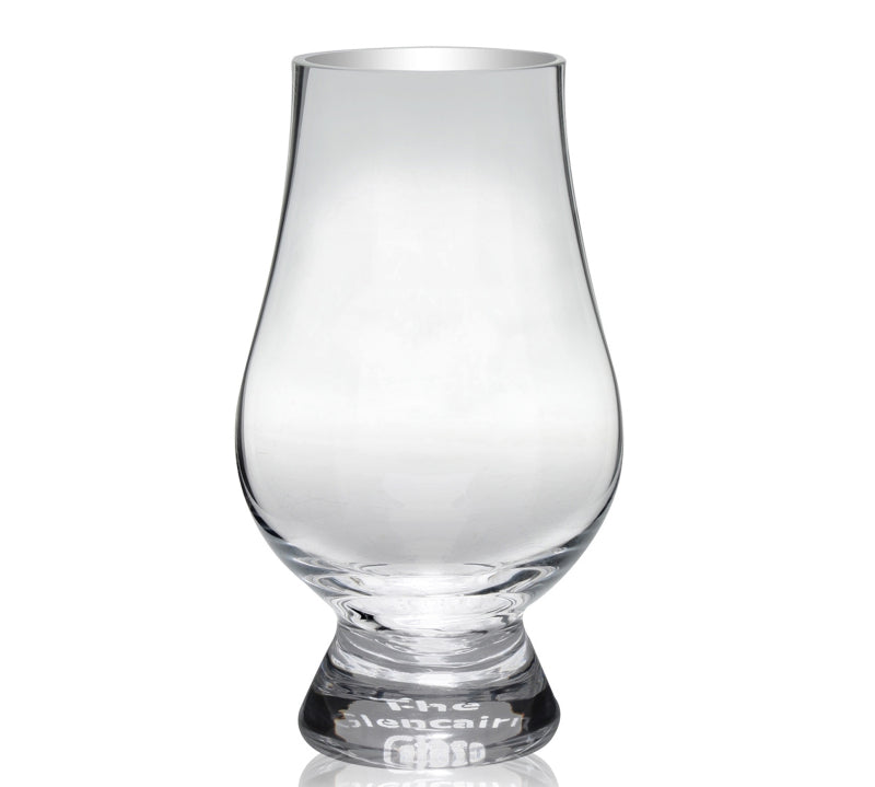 A clear, round-bottomed, stemless whisky glass with a tapered mouth, on a white background.