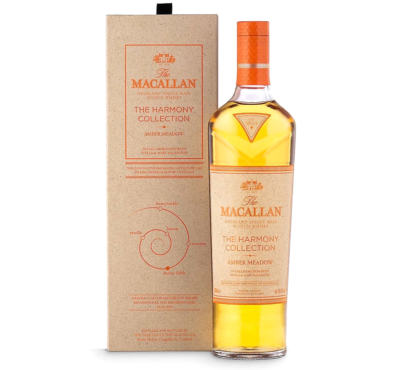 The image shows a bottle of The Macallan The Harmony Collection III Amber Meadow, accompanied by its packaging. The bottle has a amber-colored liquid and a orange label, while the box is beige with text and decorative elements.